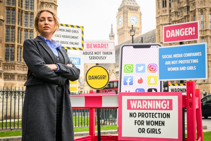 Georgia Harrison poses for photographs during a photocall to call for better online protections for women and girls