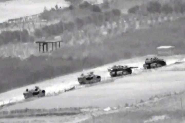 In this undated image taken from video released by Israeli Defense Forces, a line of Israeli tanks are shown during an incursion into the Gaza Strip. (Israeli Defense Forces via AP)