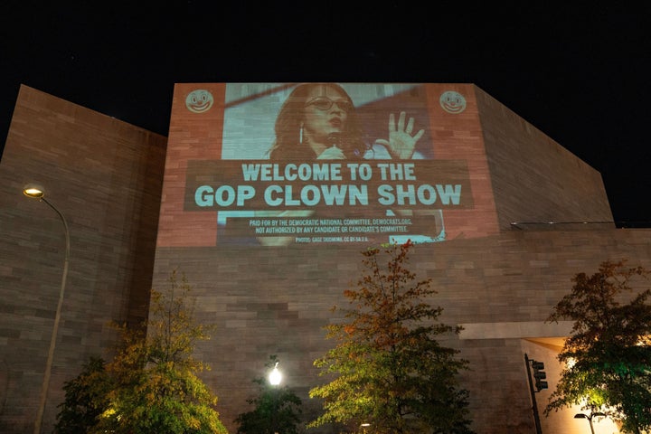 WASHINGTON, DC - OCTOBER 23: A DNC projection compares House Republicans' failure to elect a speaker to a clown show on October 23, 2023 in Washington, DC. (Photo by Leigh Vogel/Getty Images for DNC)