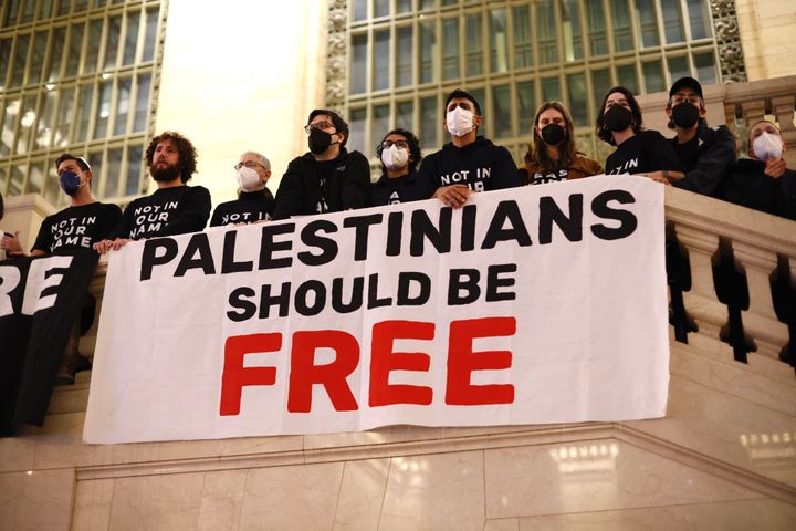 A banner reading "Palestinians Should Be Free" is seen as people demonstrate calling for a cease-fire amid war between Israel and Hamas, at Grand Central Station in New York City on October 27, 2023. 