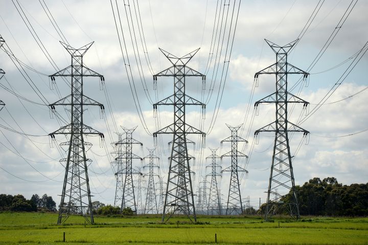 Electricity pylons and power lines against a cloudy sky. Photographer: Carla Gottgens/Bloomberg