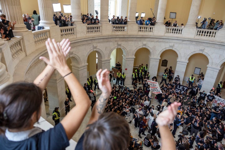 Demonstrators, calling for a ceasefire in the ongoing war between Israel and Hamas, chant and cheer during a protest inside the Cannon House Office Building at the Capitol in Washington on Wednesday, Oct. 18, 2023.