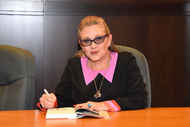 Carrie Fisher signs copies of her book "The Princess Diarist" on Nov. 28, 2016, just a month before her death.