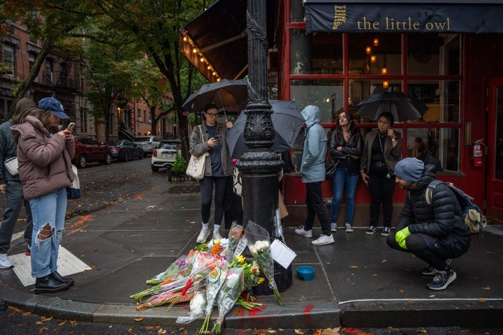 Floral tributes are left for actor Matthew Perry outside the apartment building