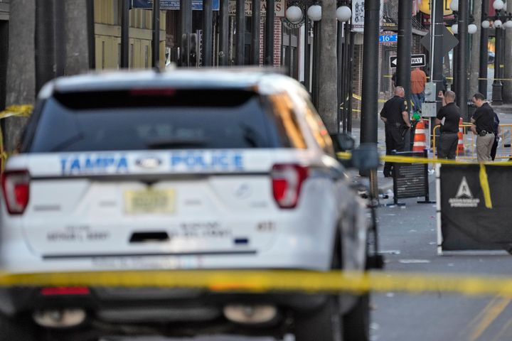 Tampa police officers stand in the street in the Ybor City of Tampa after a shooting Sunday, Oct. 29, 2023. (AP Photo/Chris O'Meara)