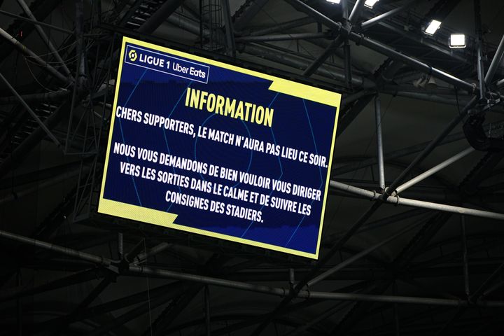 The screen with information that the French League One soccer match between Olympique de Marseille and Lyon is postponed at the Velodrome Stadium in Marseille, France.
