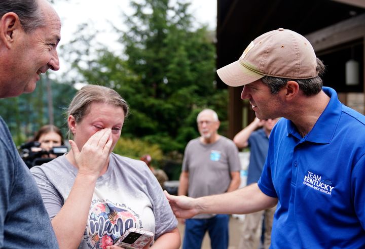 Kentucky Gov. Andy Beshear (right) talks with Samantha Rowe, of Wayland, as she cries after being displaced by floodwaters. Beshear met with people at Jenny Wiley State Resort Park on Aug. 6, 2022, in Prestonsburg to talk about recovery efforts after devastating floods in eastern Kentucky.