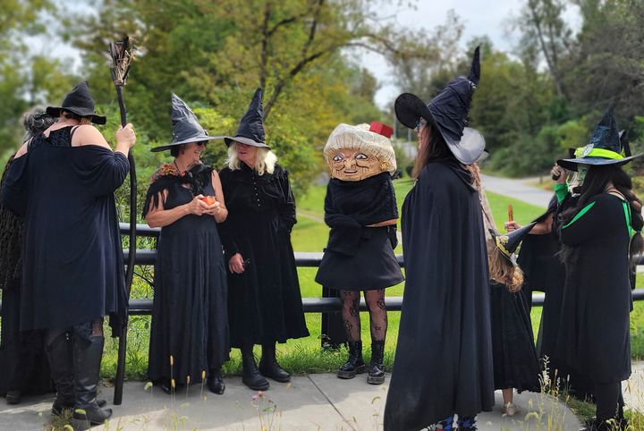 In this Sept. 16 photo provided by Alexina Jones, people dressed as witches gather for a witches' walk in Pownal, Vt., to a newly installed marker recognizing the survivor of Vermont's only recorded witch trial.