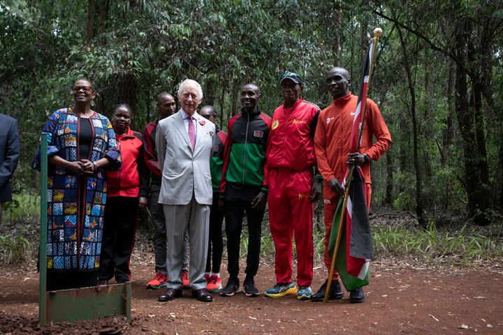 Britain's King Charles III (CL) meets with Kenyan marathon runner Eliud Kipchoge (L) and other Kenyan runners during a visit to Karura Forest in Nairobi on November 1, 2023.