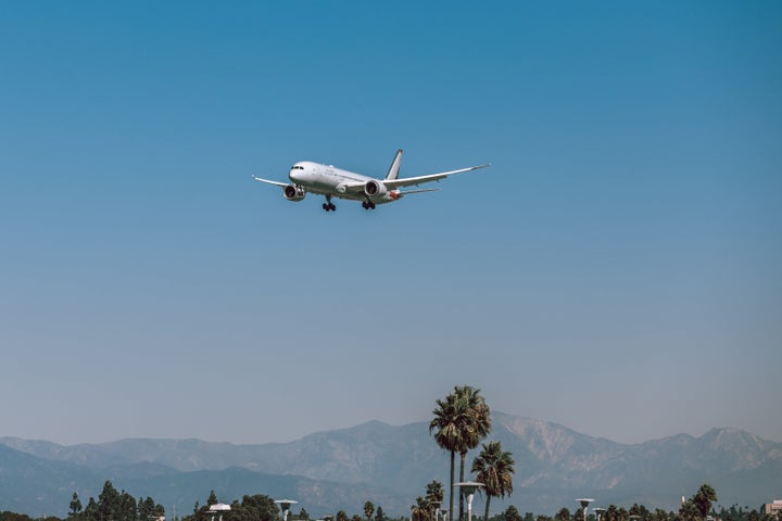 This file photograph shows a flight landing at Los Angeles International Airport. (LeoPatrizi via Getty Images)