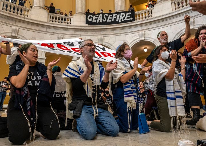A large group gathers in the rotunda of the Cannon House Office Building to stage a sit down strike as Jewish Voice for Peace holds a large rally and civil disobedience action at the U.S. Capitol, in Washington, D.C.