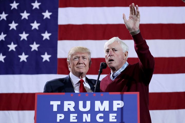 Donald Trump is introduced by former Indiana University basketball coach Bob Knight during a Republican presidential campaign rally on Oct. 31, 2016, in Grand Rapids, Michigan. Trump won the presidency a few days later.