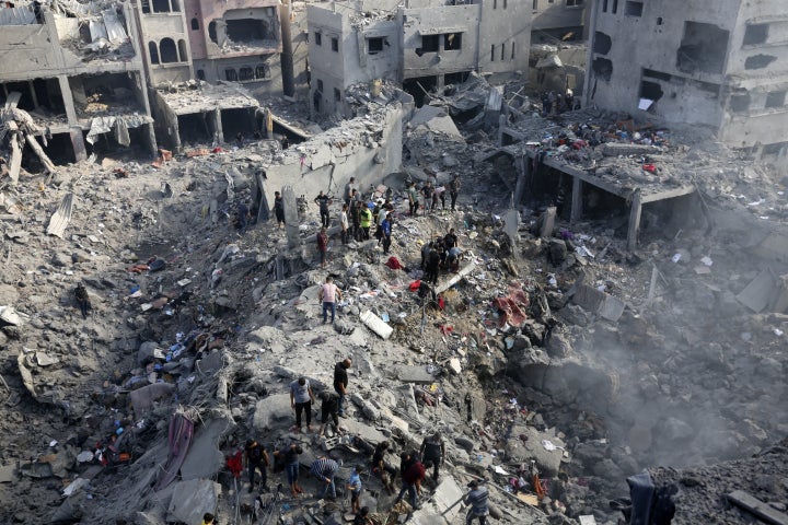 GAZA CITY, GAZA - NOVEMBER 02: Civilians conduct search and rescue operations and debris removal work at the heavily damaged buildings after Israeli attacks at Al Bureij Refugee Camp as Israeli attacks continue on the 27th day in Gaza City, Gaza on November 02, 2023. (Photo by Ashraf Amra/Anadolu via Getty Images)