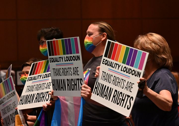 Supporters celebrate after transgender protection measures were approved during a school board meeting at the Loudoun County Public Schools Administration Building on Aug. 11, 2021, in Ashburn, Virginia.