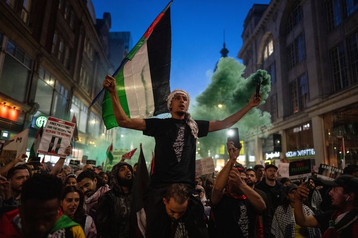 People take part in a demonstration in support of Palestine at the Israeli Embassy on October 9, 2023 in London, England. 