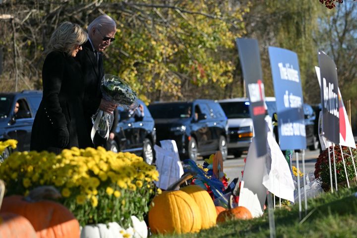 President Joe Biden and first lady Jill Biden pay their respects outside Schemengees Bar and Grille in Lewiston, Maine, on Nov. 3.