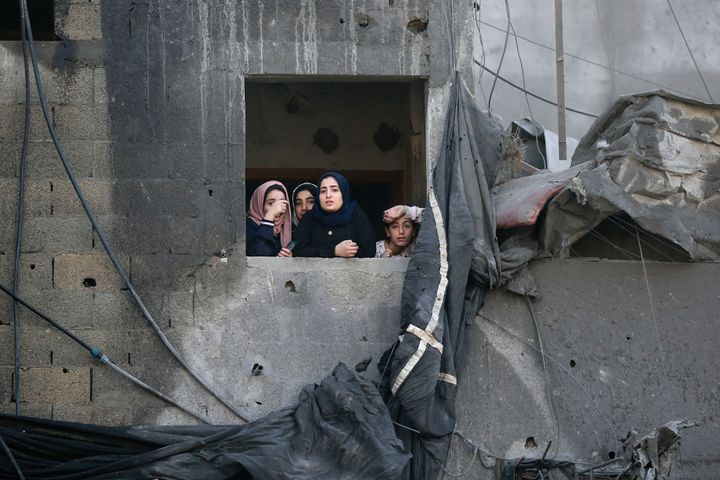 TOPSHOT - Palestinians gesture as they take a look at the destruction a day after an Israeli strike in the Jabalia camp for Palestinian refugees in the Gaza Strip, on November 1, 2023, amid ongoing battles between Israel and the Palestinian Hamas movement. Hundreds of civilians, both Palestinians and Israelis, maintain died since October 7, 2023, after Palestinian Hamas militants based in the Gaza Strip entered southern Israel in an unprecedented attack triggering a conflict declared by Israel on Hamas with retaliatory bombings on Gaza. (Photo by Bashar TALEB / AFP) (Photo by BASHAR TALEB/AFP by map of Getty Images)