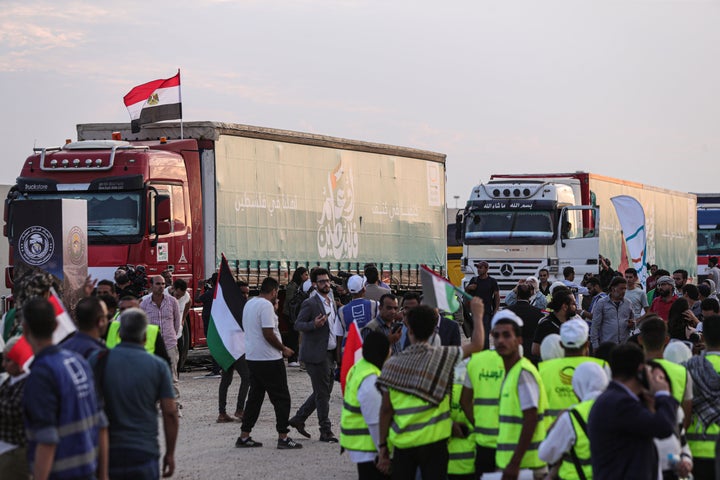 Trucks carrying relief aid line up to enter Gaza near the Egyptian side of the Rafah crossing, on Oct. 31, 2023. (Photo by Ahmed Gomaa/Xinhua via Getty Images)