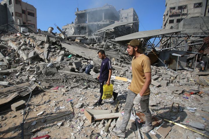 Palestinians inspect the damage in Gaza City's Shati refugee camp on November 6, 2023