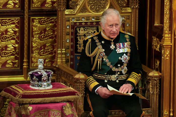 Charles reading the Queen's speech, on behalf of his mother, next to her crown during the State Opening of Parliament, at the Palace of Westminster in London, Tuesday, May 10, 2022.