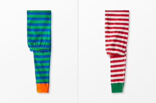 Two pairs of the iconic Hanna Andersson striped pajamas.