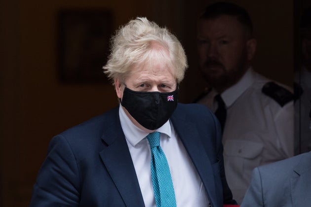 LONDON, UNITED KINGDOM - JANUARY 26, 2022: British Prime Minister Boris Johnson leaves 10 Downing Street for PMQs at the House of Commons on January 26, 2022 in London, England. The findings from Sue Gray's inquiry into several alleged lockdown rule-breaking parties at Downing Street, during the time when strict Covid-19 restrictions were in place, are expected to be published this week while Metropolitan Police announced yesterday it's conducting its own investigation into the alleged events. (Photo credit should read Wiktor Szymanowicz/Future Publishing via Getty Images)