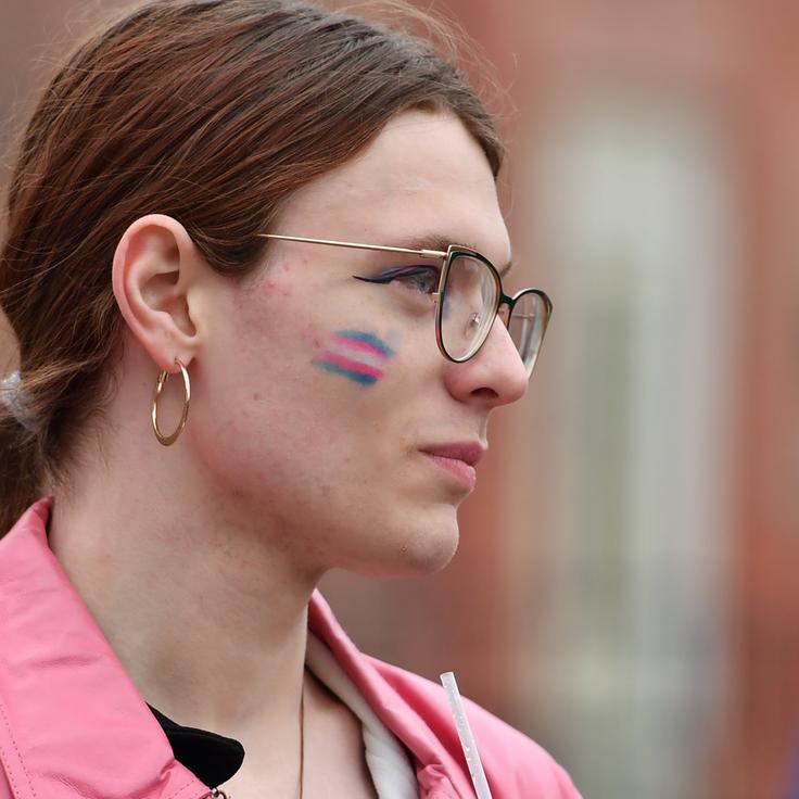 Jackie St. Claire wears transgender flag paint on her face at the Transgender day of Visibility on March 31.