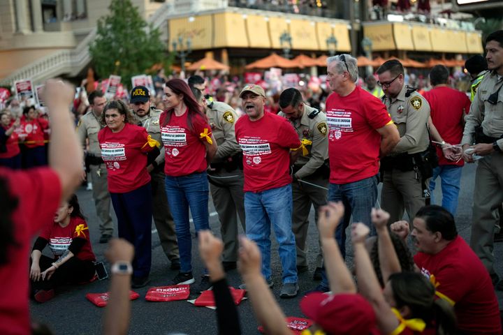 Las Vegas authorities arrest members of the Culinary Workers Union along the Strip on Oct. 25. The union has been in contract fights with Caesars Entertainment, MGM Resorts and Wynn Resorts.