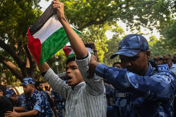 Indian police in New Delhi detains an activist during a protest in support of Palestinians in Gaza on October 27, 2023. Indian authorities are barring any solidarity protests in support of Palestinian liberation, a shift in the country's foreign policy that has historically sided with the occupied population.