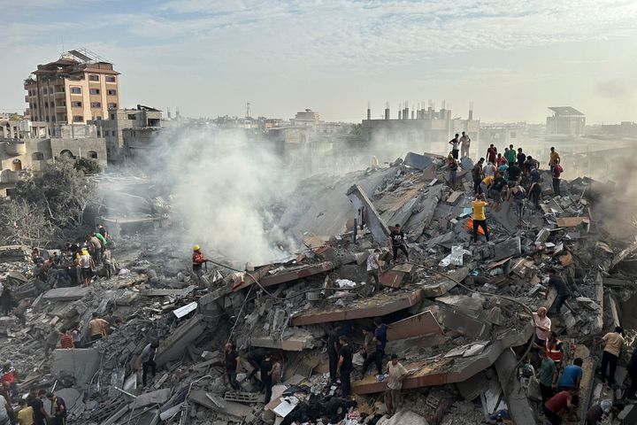 Palestinians look for survivors following Israeli airstrike in Nusseirat refugee camp, Gaza Strip