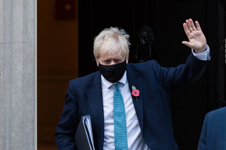 Boris Johnson leaves 10 Downing Street during the pandemic.