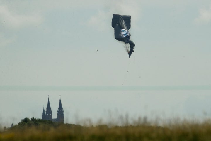 In this June 15, 2017 file photo, a blimp crashes during the first round of the U.S. Open golf tournament near Erin Hills in Erin, Wis. The pilot was badly injured but survived, according to a National Transportation Safety Board investigation. Patrick Parker Walsh's bid to save his aerial advertising businesses started out legitimately but quickly escalated into sizeable fraud. 