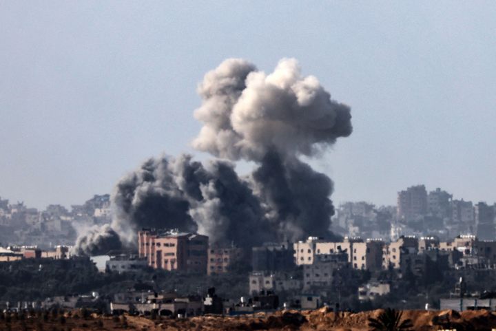 This picture, taken from the Israeli side of the border with the Gaza Strip on November 10, 2023, shows smoke rising above buildings during an Israeli strike on the northern part of the Palestinian enclave, amid ongoing battles between Israel and the Palestinian Hamas movement. (Photo by JACK GUEZ/AFP via Getty Images)