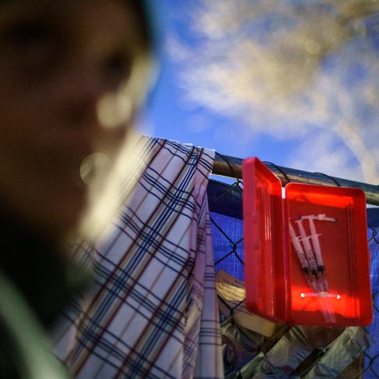 Prefilled syringes of naloxone are ready for use outside the gate where dozens of Native women are living in tents in the lot of an abandoned gas station in south Minneapolis, Monday, Nov. 15, 2021.