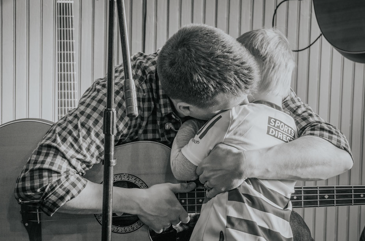 The author's husband, Pearse, hugging their son, Logan.