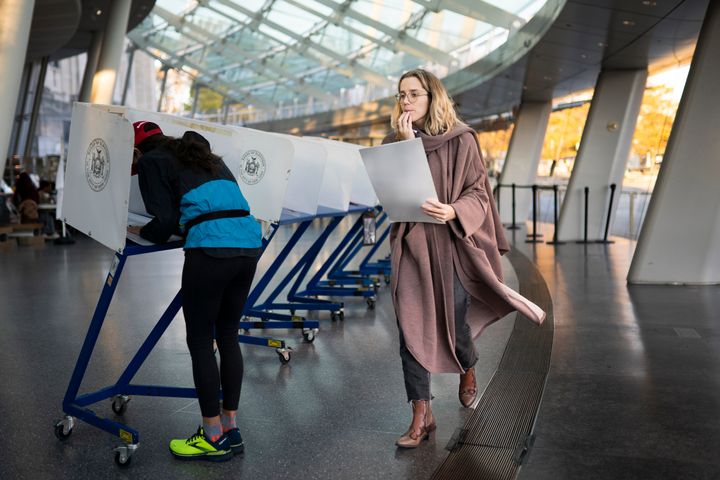 A voter moves to cast her ballot at a polling site in the Brooklyn Museum on Nov. 8, 2022. A new nonpartisan effort aims to register 20,000 new student voters ages 18-26.