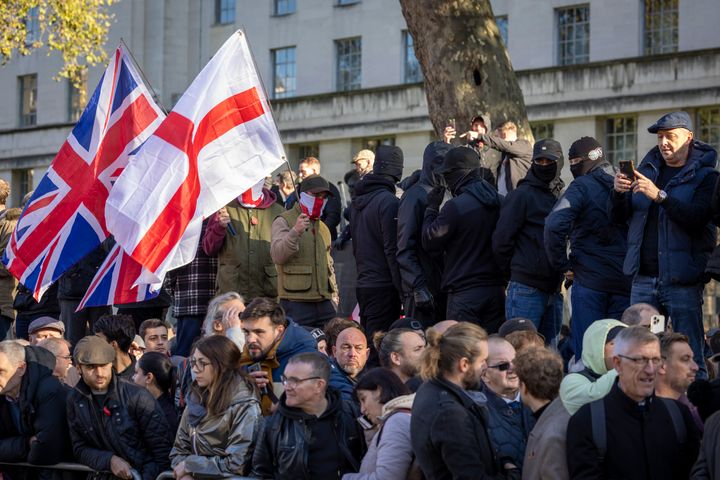 Far right groups and football hooligans watch members of the armed forces lay wreaths, and observe 2 minute silence to remember those that have lost their lives in war at the Cenotaph on Armistice Day.