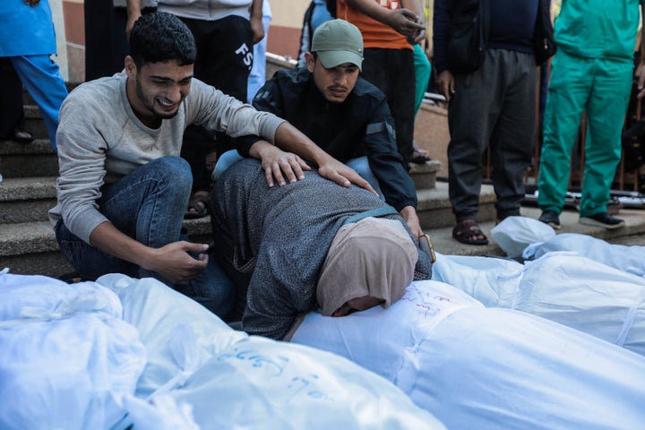 (EDITORS NOTE: Image depicts death.) People mourn as they collect the bodies of Palestinians killed in Israeli raids on November 15, 2023 in Khan Yunis, Gaza. Due to a lack of fuel needed to operate the generators, hospitals are deprived of electricity. The WHO, once again in contact with the Al-Shifa hospital in Gaza, considers "the situation disastrous and perilous."