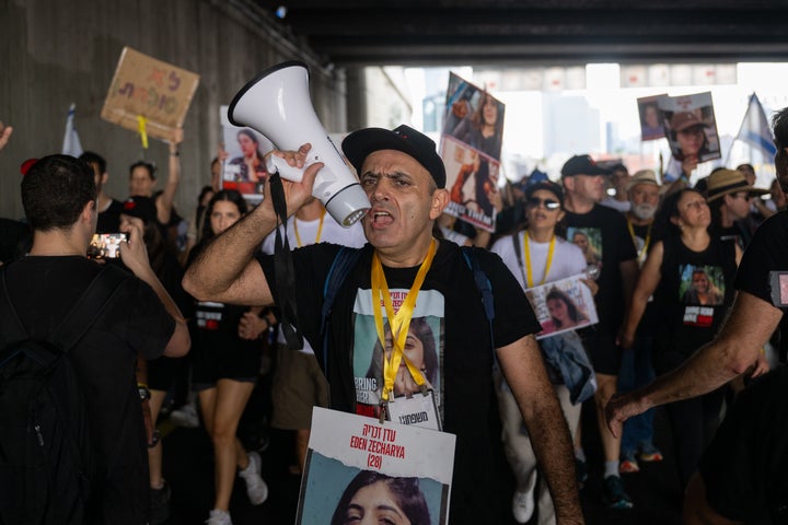 Families of hostages and their supporters march along Israel's Ayalon freeway during the five-day “March for the Hostages” from Tel Aviv to Jerusalem on November 14, 2023. According to Israeli officials, over 240 hostages are being held by Hamas in the Gaza Strip.