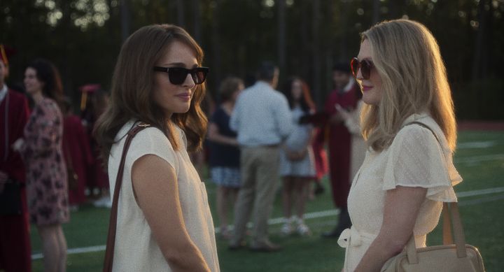 Natalie Portman (left) and Julianne Moore are superb as white women who stake a claim in the well-being of a vulnerable young Asian American man.