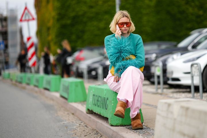 A guest at Copenhagen Fashion Week wears Ugg boots in August 2023.