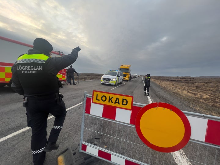 Police direct traffic out of Grindavik on Nov. 14. For the second day, residents were allowed to collect personal belongings quickly. 