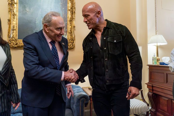 Dwayne "The Rock" Johnson, right, meets with Senate Majority Leader Chuck Schumer, of N.Y., Wednesday, November 15, 2023, at the Capitol in Washington.