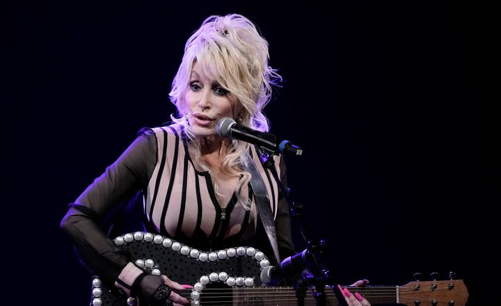 Dolly Parton appears in Kansas on Aug. 14. On the final episode of her Apple Music 1 radio show, she explains why her husband doesn't do public events with her.