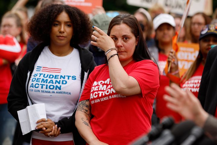 Ade Osadolor (left), a Texas native and a member of the Students Demand Action National Advisory Board, and Erica Leslie Lafferty, whose mother was killed at Sandy Hook Elementary in 2012, attend a rally with fellow Congressional Democrats and gun control advocacy groups outside the U.S. Capitol on May 26, 2022, in Washington, D.C.
