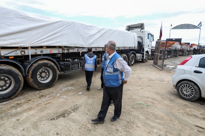 Trucks carrying humanitarian aid enters the Rafah border crossing as the Israeli attacks continue in Rafah, Gaza on November 15, 2023.