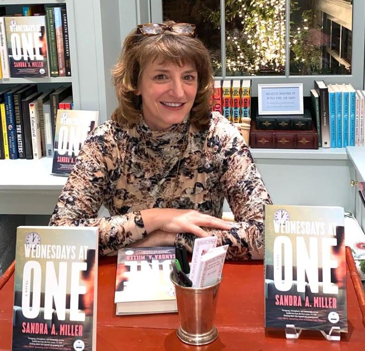 The author at a book signing for her debut novel.