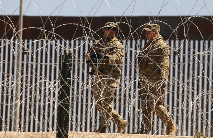 Members of the US military patrol the banks of the Rio Grande as seen from Ciudad Juarez, Chihuahua state, Mexico on May 8, 2023. (Photo by HERIKA MARTINEZ/AFP via Getty Images)