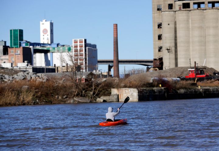 A kayaker paddles along the Buffalo River in Buffalo, New York. A survey of trash collected along the river last year found that most of the plastic that could be identified with a brand had come from PepsiCo.