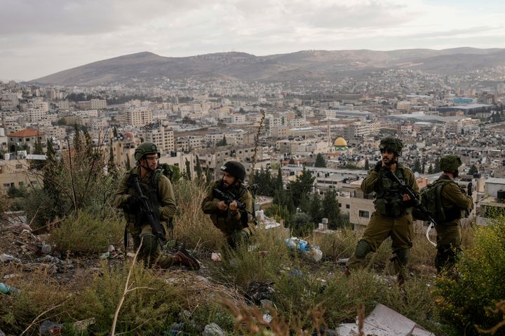 Israeli soldiers are seen during a military operation in the Balata refugee camp, West Bank, Sunday, Nov. 19, 2023.